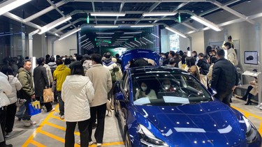 People protest at a Tesla showroom in Chengdu, Sichuan, China, released January 6, 2023 in this picture obtained by Reuters from social media.