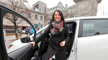 Montreal Mayor Valérie Plante tries out one of the first 100 Nissan Leaf electric cars added to the city's fleet on April 19, 2018. As of October, just 495 vehicles — 5.9 per cent of Montreal's overall fleet — were electric or hybrid.