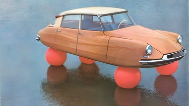 Balloon-wheeled Citroen 'DS sur ballons' floating on a lake