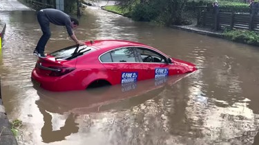 A driver gets stuck trying to cross the Rufford ford in the U.K.