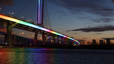 Samuel de Champlain bridge in Montreal, Canada, illuminated with rainbow colors in support of the coronavirus pandemic first responders