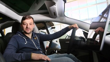 University of Windsor professor Francesco Biondi is shown behind the wheel of a Tesla at the campus on Tuesday, May 17, 2022.