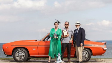 Timothy Schell (middle) won the 2022 Chief Judge's Choice award at the Cobble Beach Concours d'Elegance car show in Georgian Bay for his red 1969 Chevrolet Yenko Camaro. (Facebook)