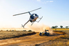 Daniel Ricciardo driving the Red Bull RB7 Formula One car across the Australian outback