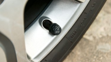 Valve stem on a wheel with a modern Tire Pressure Monitoring Sensor installed