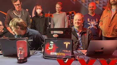 The Synacktiv team at Pwn2Own after hacking a Tesla