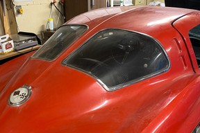 As found, a teaser shot of a barn find 1963 Corvette with its signature split rear window. This car will be sold at the 2023 Enthusiast Collector Car Auction, running May 26 and 27 with live viewing and online-only bidding.