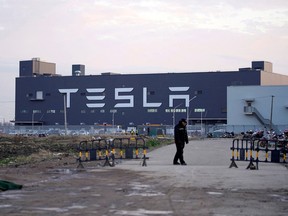 A Tesla sign is seen on the Shanghai Gigafactory of the U.S. electric car maker before a delivery ceremony in Shanghai, China January 7, 2020