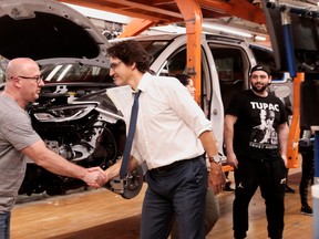 Canadian Prime Minister Justin Trudeau greets a Stellantis auto assembly worker during a tour of the Windsor Assembly Plant in Windsor, Ontario, Canada on January 17, 2023
