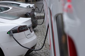 Tesla electric cars charge at a Tesla charging station on October 5, 2021 in Berlin, Germany