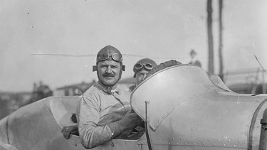 Race car driver Louis Chevrolet (1878-1941) and his riding mechanic at the 1916 Astor Cup race at Sheepshead Bay Speedway, Long Island, N.Y. Chevrolet founded the Chevrolet Motor Company in 1911.