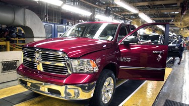 A Ram 1500 truck goes through a quality control check before coming off the assembly line at the Warren Truck Assembly Plant September 25, 2014 in Warren, Michigan