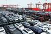 In this photo taken on September 11, 2023, BYD electric cars waiting to be loaded on a ship are stacked at the international container terminal of Taicang Port at Suzhou Port, in China's eastern Jiangsu Province