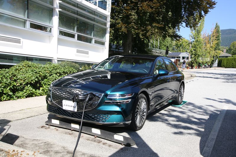 The 2023 Genesis Electrified G80 charging up at a free FLO charger at North Vancouver District Hall.
