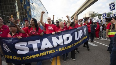 UAW President Shawn Fain marches with UAW members through downtown Detroit after a rally in support of the United Auto Workers members as they strike the Big Three auto makers on September 15, 2023 in Detroit, Michigan