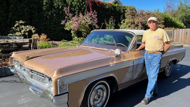 Jamie Cox with his pride and joy, a 1963 Oldsmobile Starfire.