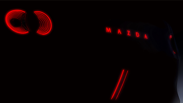 A teaser image for a Mazda MX-5 Miata Concept, revealed at the 2023 Japan Mobility Show