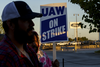 Factory workers and UAW union members form a picket line outside the Ford Motor Co. Kentucky Truck Plant in the early morning hours on October 14, 2023 in Louisville, Kentucky