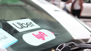 A Lyft decal is seen on a car in the pick-up area at JFK Airport on April 28, 2023 in New York City