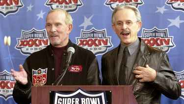 U.S. comedians Tom (left) and his brother Dick (right) Smothers address a press conference, January 28, 2000, at the Georgia Dome in Atlanta, Georgia