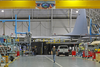 An aircraft mechanic walks the floor as they work on a Lockheed C-130 Hercules cargo plane on December 20, 2017 at Hill Air Force base in Ogden, Utah