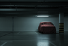 A car under a cover in a parking garage