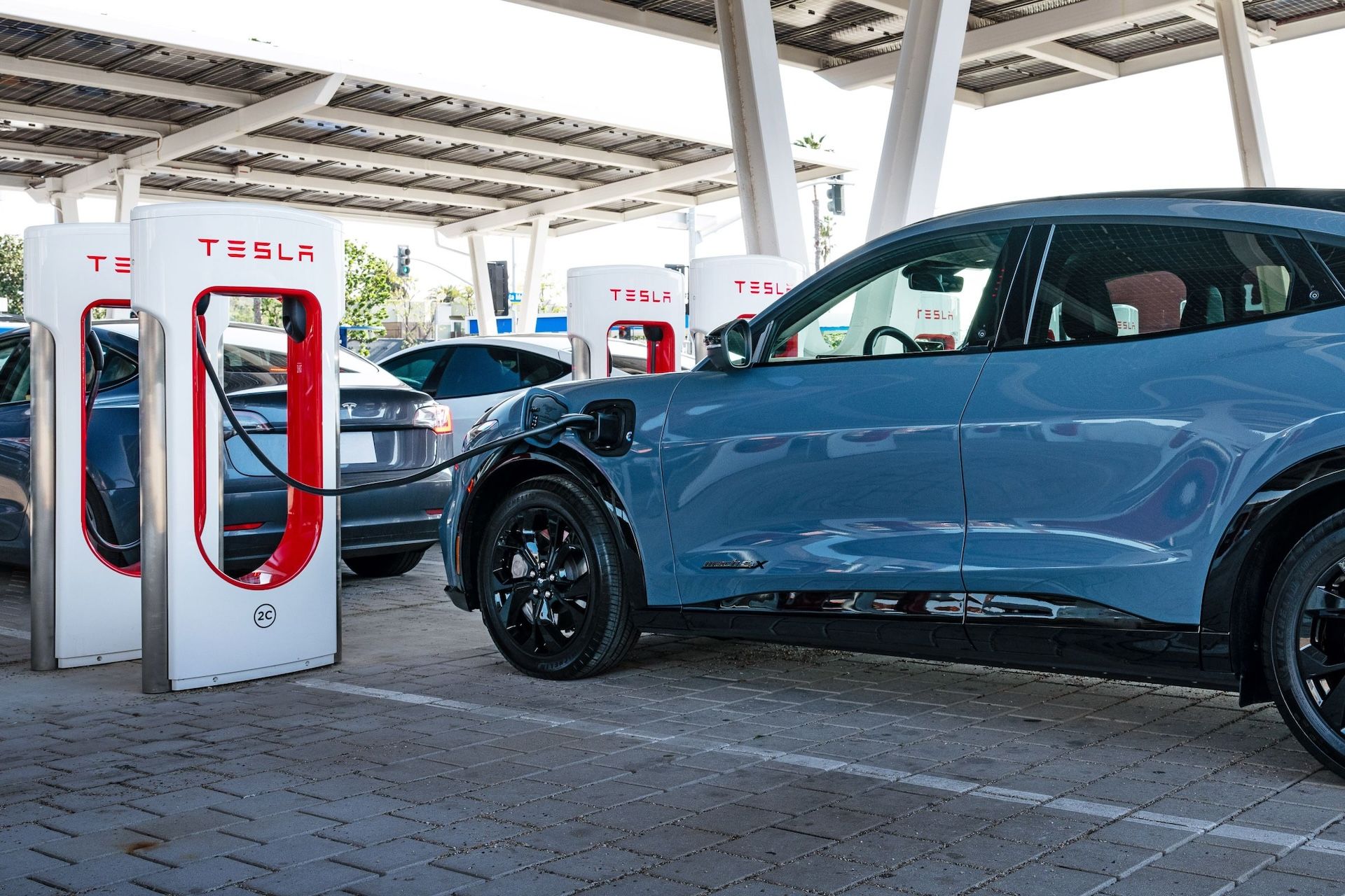 Can mustang mach e store use tesla supercharger