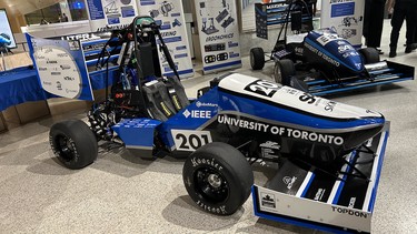 The University of Toronto Formula Racing team's UT24 car (foreground) for 2024; and last year's UT23 car (background)