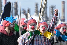 Extinction Rebellion activists protest outside a TotalEnergies refinery in March.