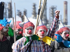 Extinction Rebellion activists protest outside a TotalEnergies refinery in March.