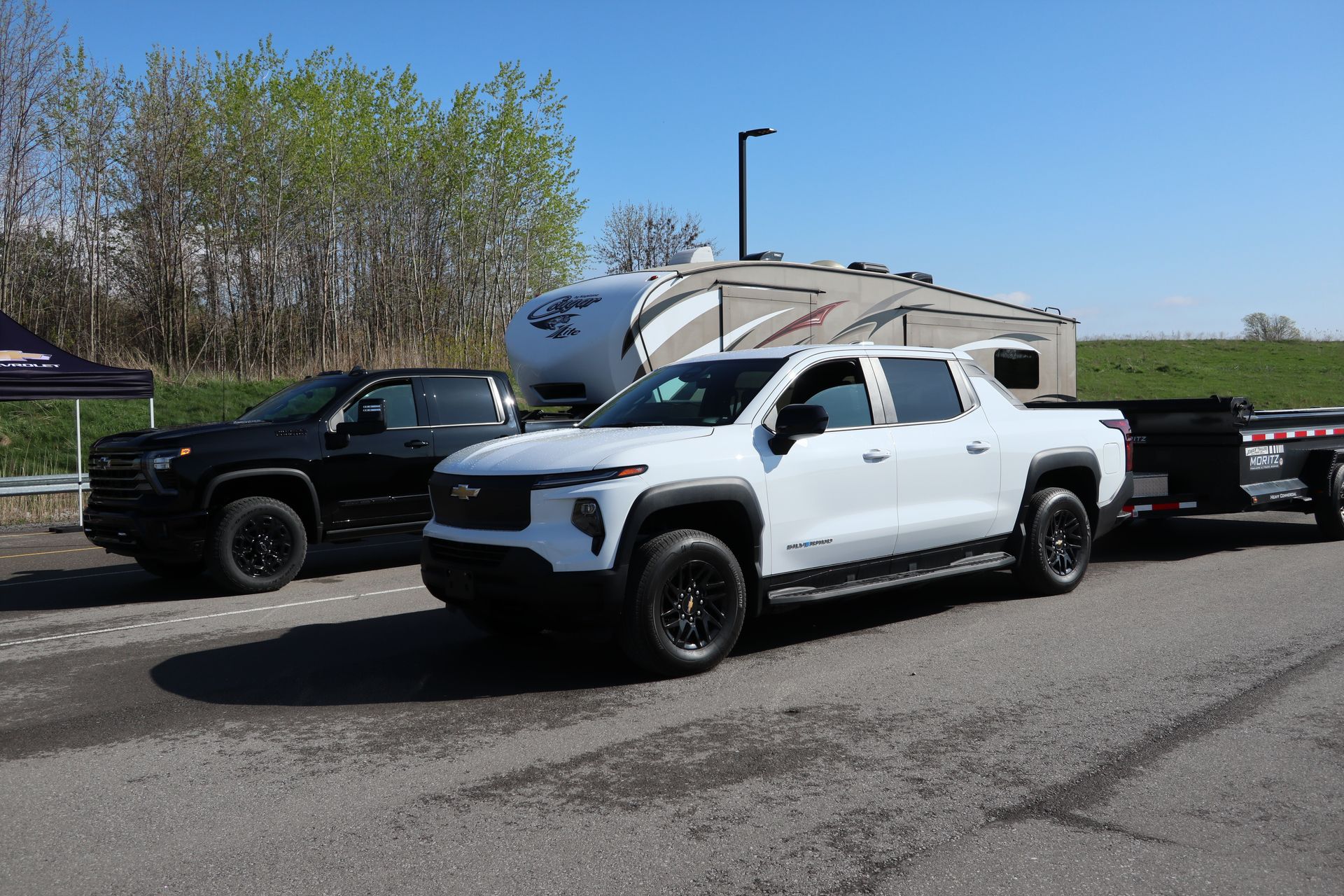 Diesel and electric Chevrolet Silverados on a test track