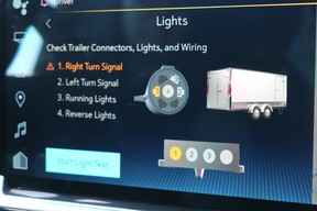 The automated light check indicates an issue with the trailer's turn signal