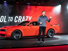 Tim Kuniskis, the CEO Dodge, on stage with the Dodge Challenger Demon in 2021