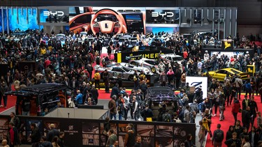 Visitors are seen during the first public day of the Geneva International Motor Show in Geneva, on February 28, 2024