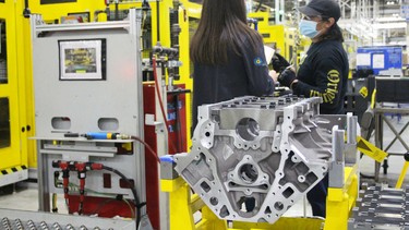 Workers assembles a V8 engine at General Motors' St. Catharines, Ontario plant