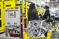 Workers assembles a V8 engine at General Motors' St. Catharines, Ontario plant