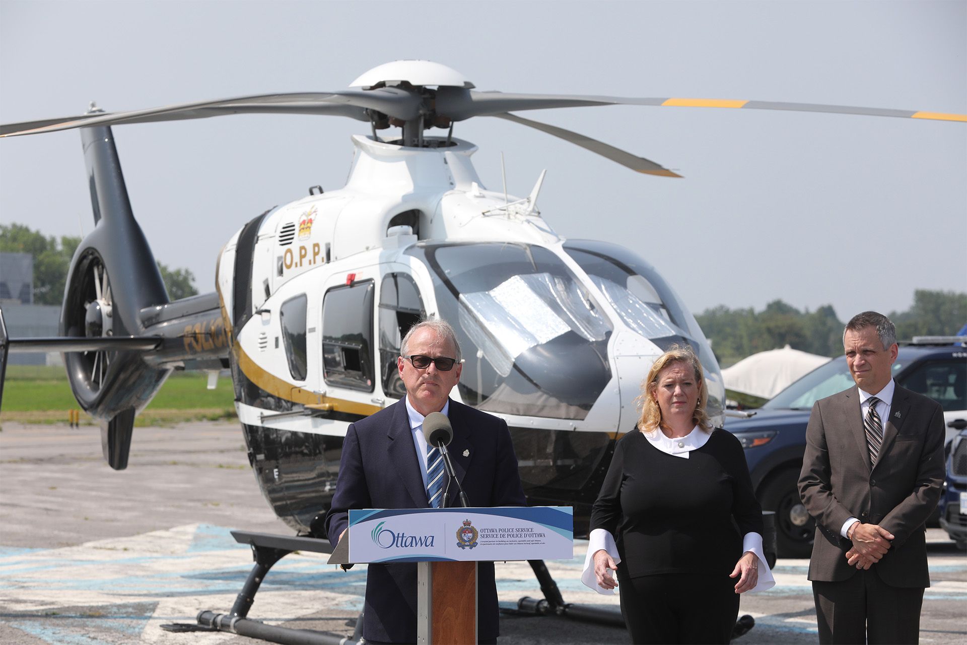 (from left to right) Michael Kerzner, Solicitor General of Ontario; Lisa MacLeod, MPP; and Ottawa Mayor Mark Sutcliffe were present for the unveiling of a new OPP helicopter that the Ottawa Police will be able to use, during a press conference held at the Ottawa Rockcliffe Airport, July 30, 2024