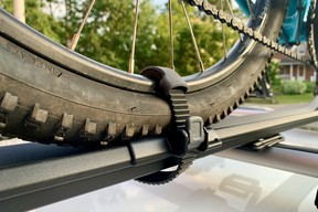Detail shot of rear wheel attached to Thule FastRide bike rack