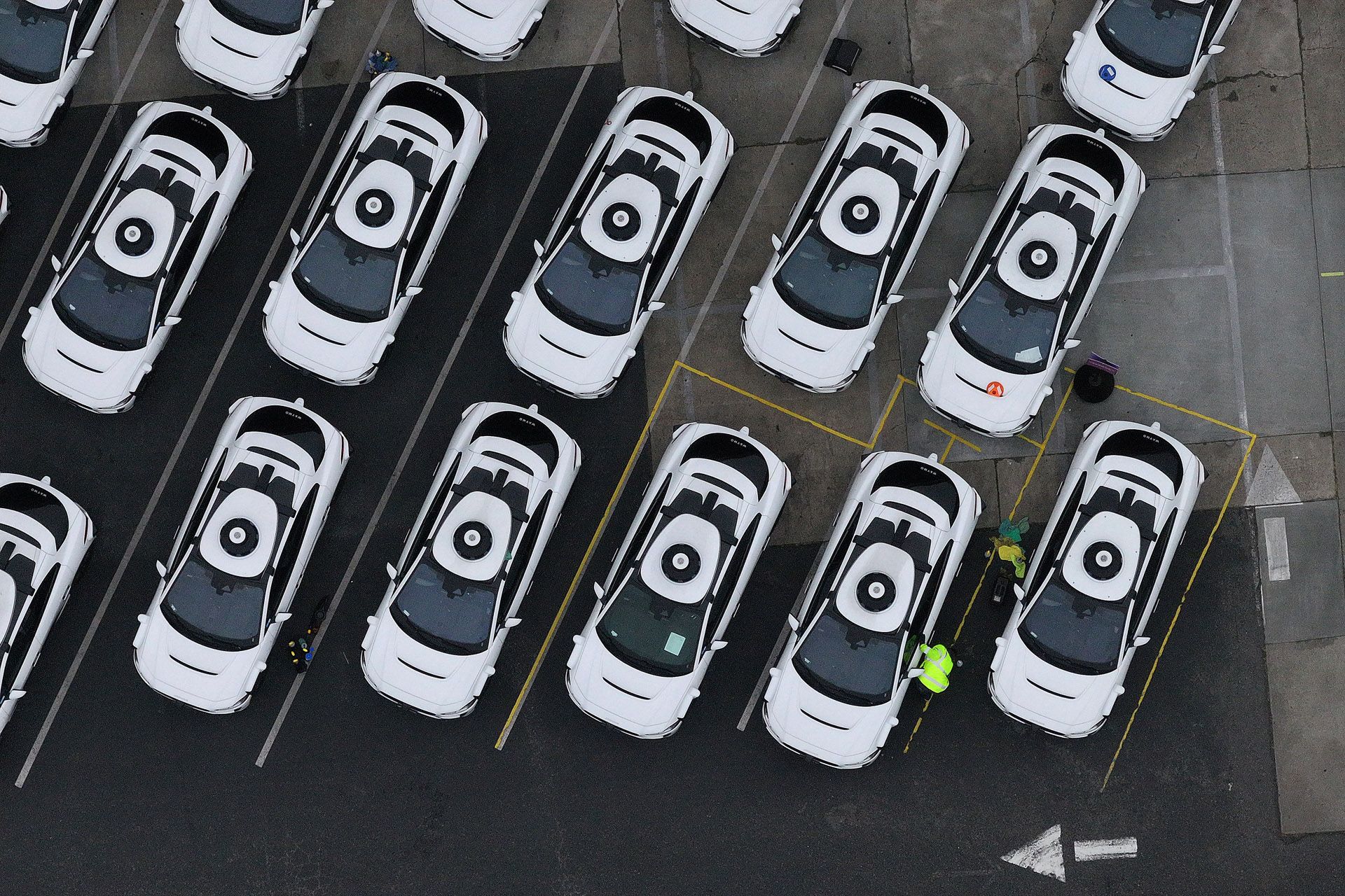 In an aerial view, Waymo self-driving cars are seen parked at a Waymo facility on June 10, 2025 in San Francisco, California
