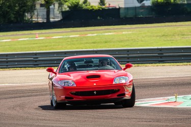 A Ferrari 550 Maranello being hooned around Circuit Fiorano as part of Ferrari's Corso Pilota program