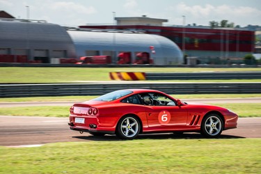 A Ferrari 550 Maranello being hooned around Circuit Fiorano as part of Ferrari's Corso Pilota program