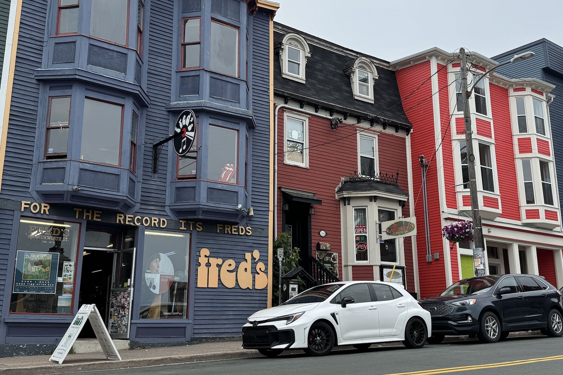 2025 Toyota GR Corolla in front of Fred's Records on Duckworth Street