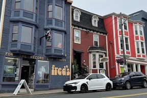 2025 Toyota GR Corolla in front of Fred's Records on Duckworth Street