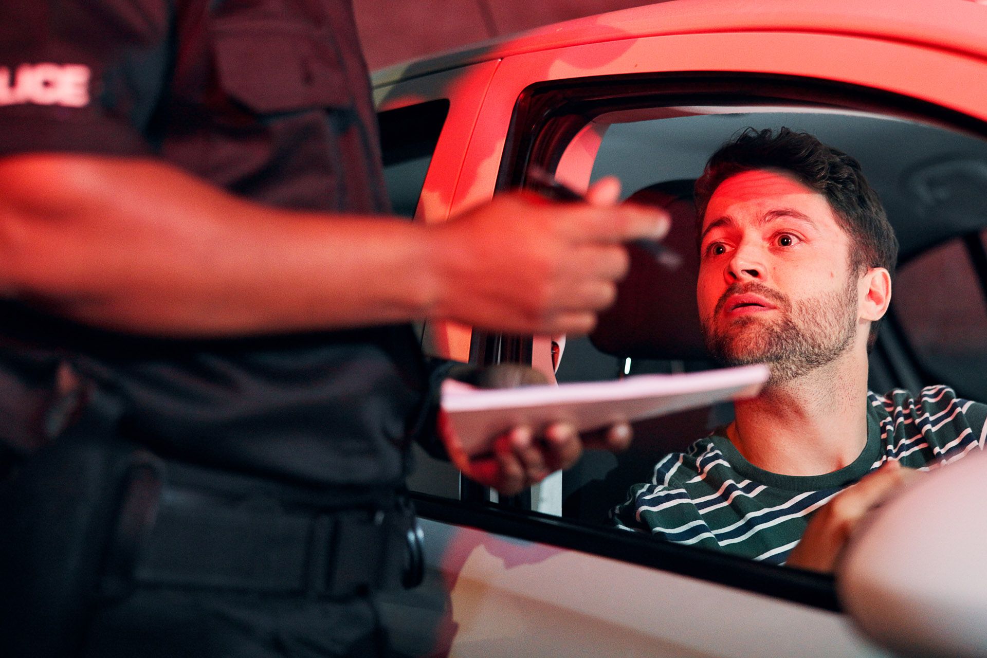 A young driver pulled over by police during a DUI traffic stop