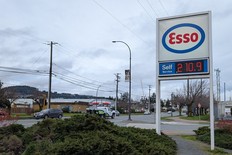 A per-litre price sign in front of an Esso gas station in Vancouver, B.C. in early March 2026