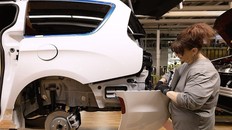 A worker installs a rear bumper on a Chrysler Pacifica at the Stellantis Windsor assembly plant on Thursday, May 28, 2026. (Dan Janisse/Windsor Star)