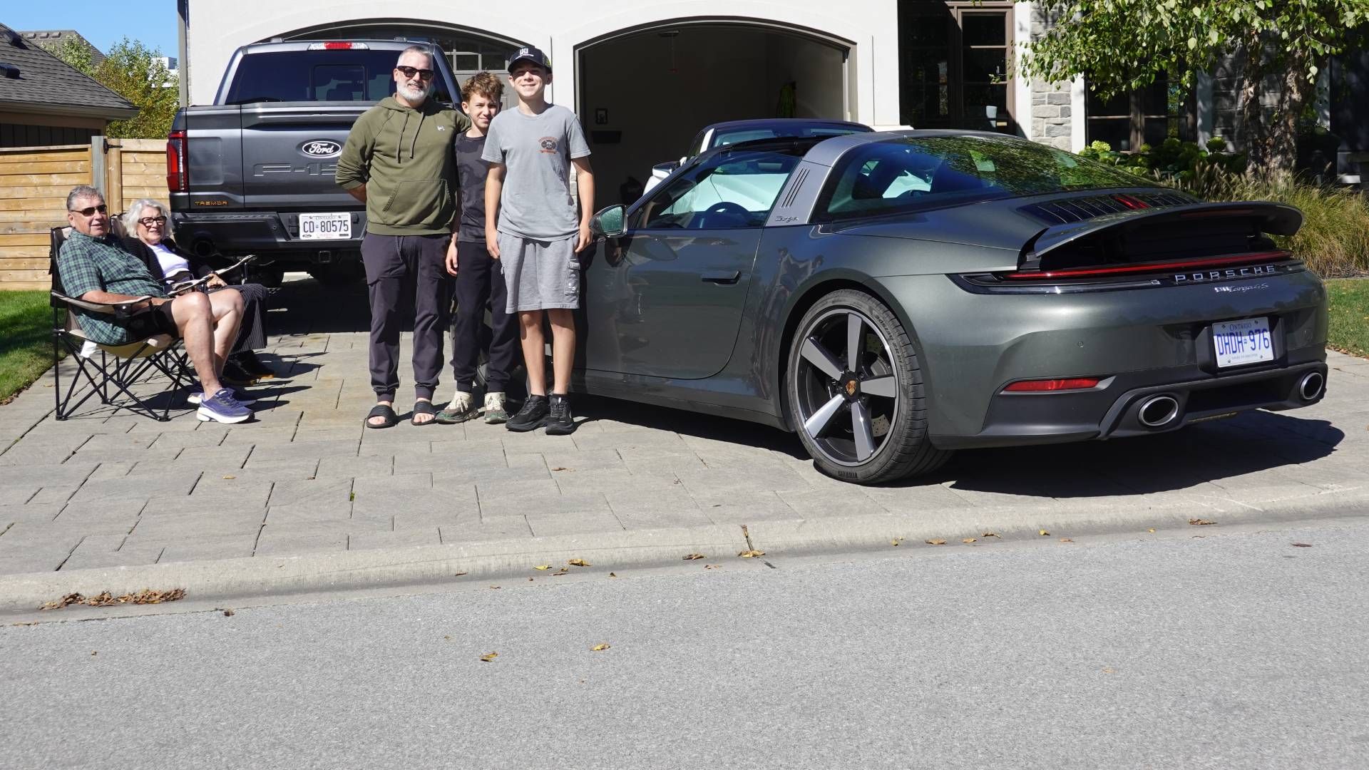 Ron with grandkids Hunter and Lucas in front of the Porsche 911 Targa 4S press car on loan to author David Booth