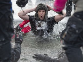 Sgt. Darryl McDonald from Edmonton Police downtown division, Squad 3, was among the roughly 200 people registered for the Polar Plunge benefitting Special Olympics that took place at Summerside Lake in Edmonton on Sunday, Jan. 29, 2023.