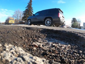 The freeze-thaw cycle of weather in the winter months early in 2023 created potholes on many city streets in Edmonton on Tuesday, Feb. 14, 2023.