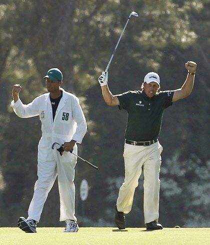 Phil Mickelson (right) celebrates his eagle at the 14th hole with caddie Jim Mackay. Mickelson became just the third player to record successive eagles at the US Masters.